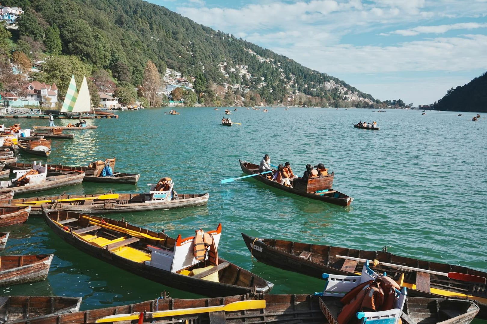 scenic boat ride on nainital lake with hills