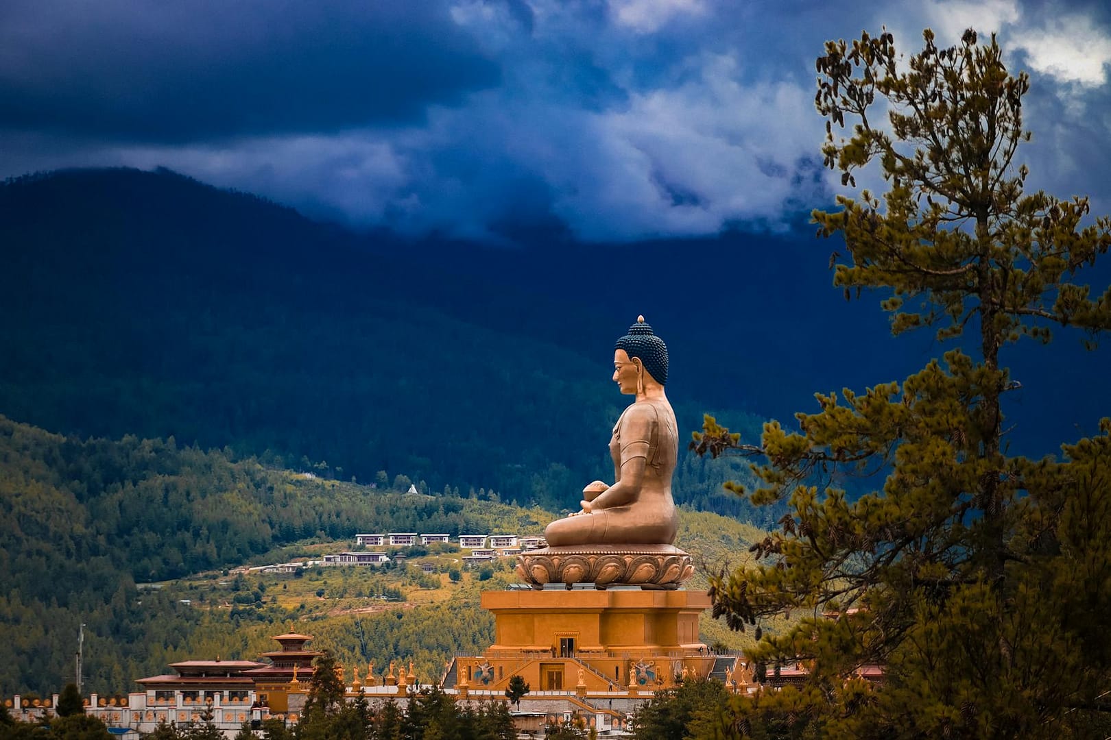 brown statue under cloudy sky