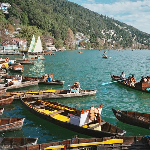 scenic boat ride on nainital lake with hills