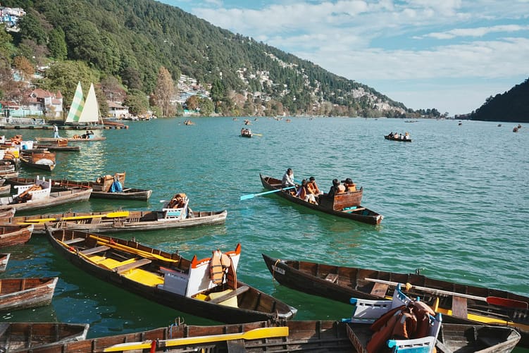 scenic boat ride on nainital lake with hills
