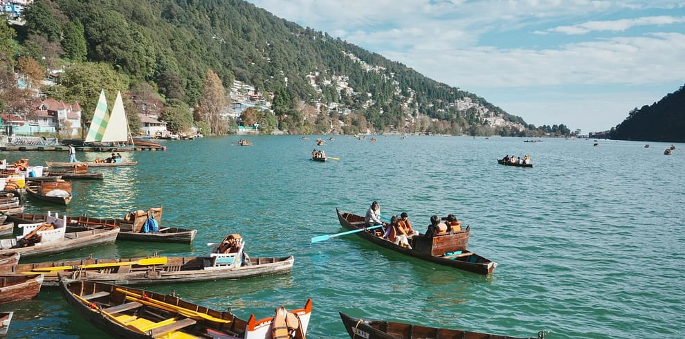 scenic boat ride on nainital lake with hills