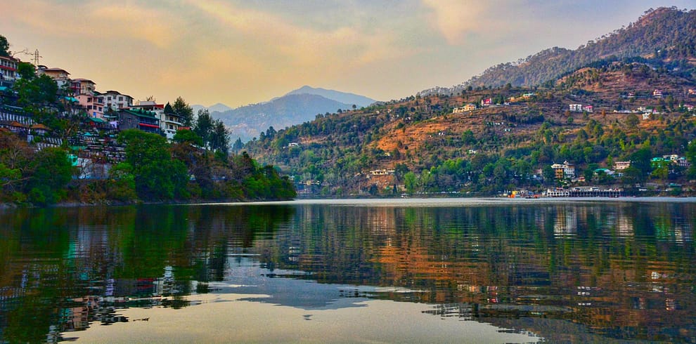 photo of green and brown mountains under cloudy sky